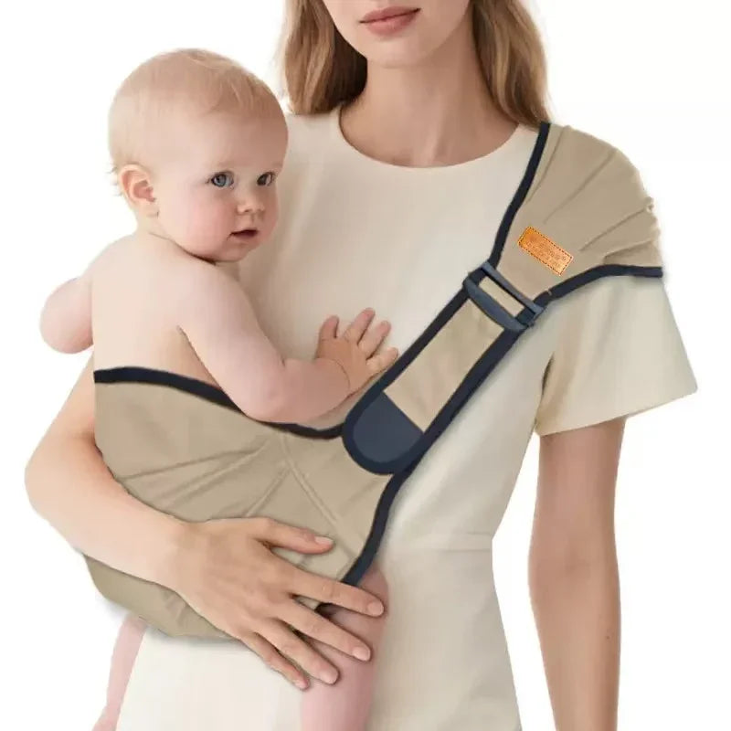 Woman using beige baby carrier with newborn, ergonomic infant wrap for hands-free carrying