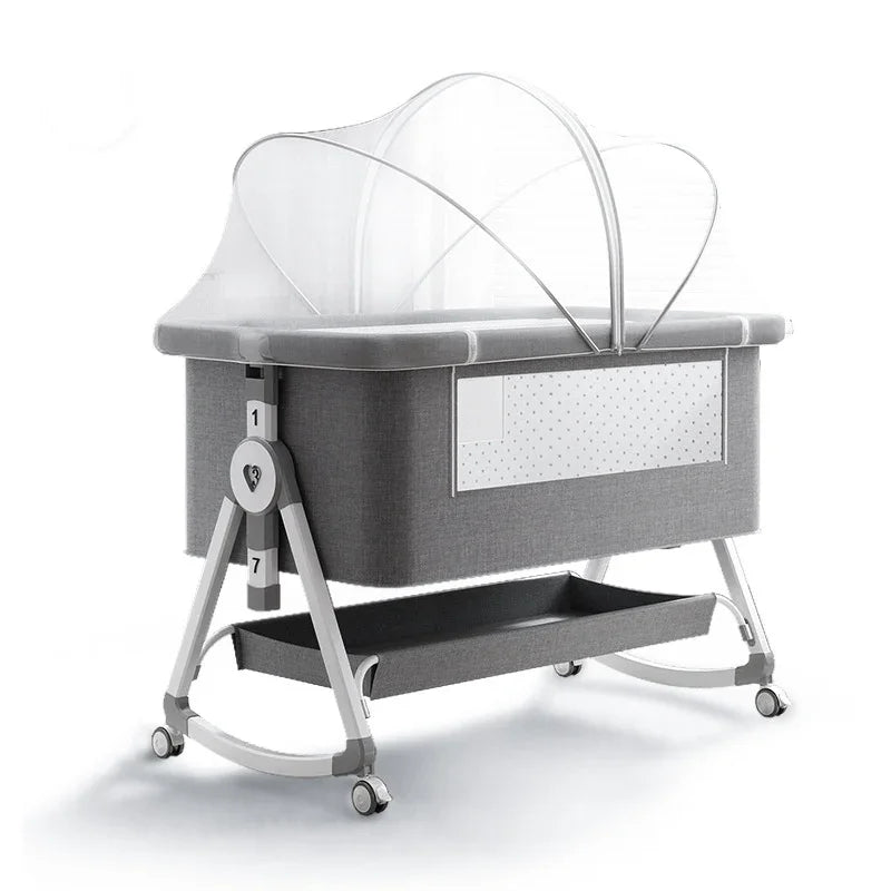 Gray portable baby bassinet with mosquito net, wheels, and storage shelf for newborns